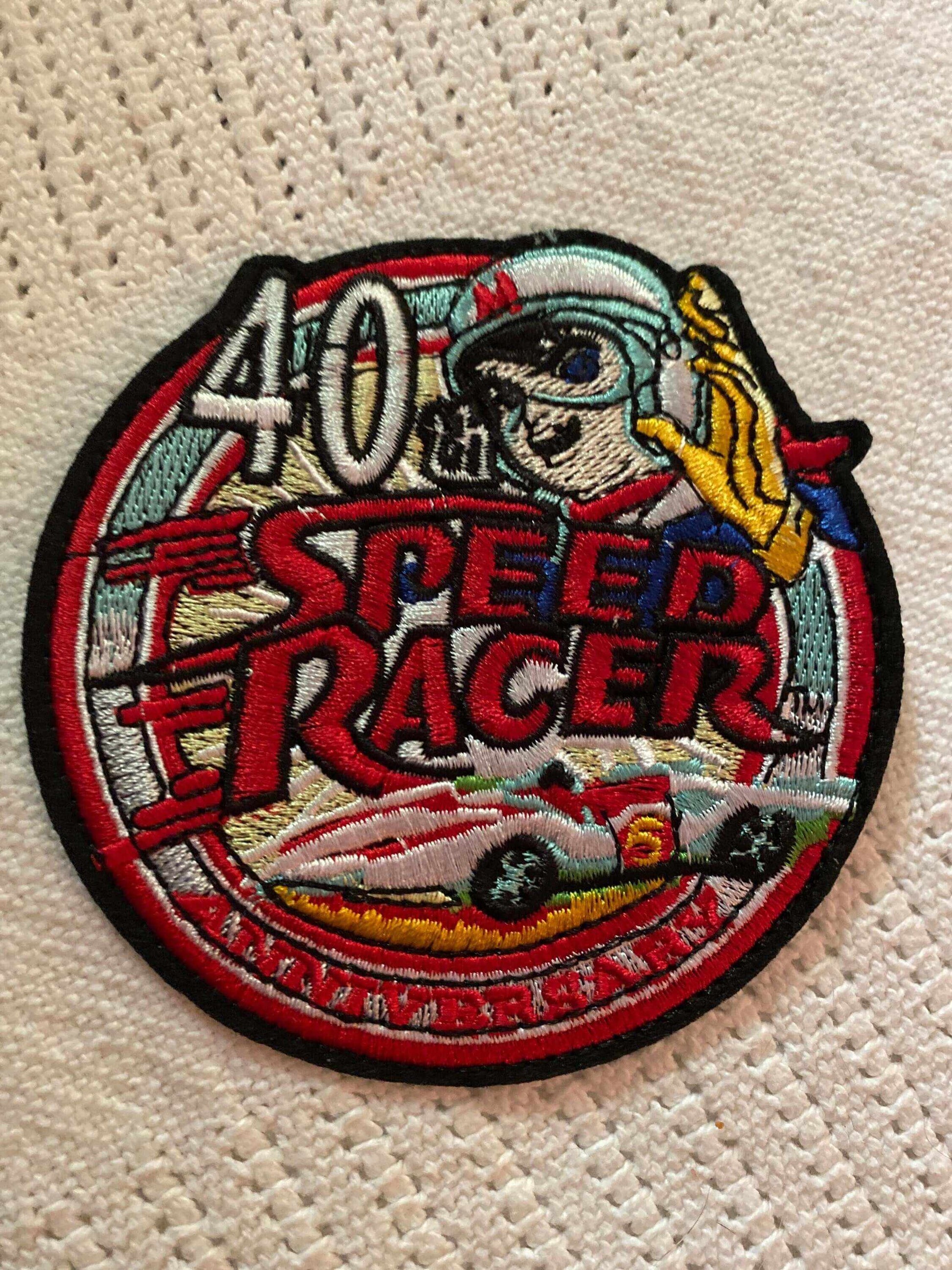 Speed Racer 40th Anniversary embroidered patch featuring Racer X and Mach 5 race car design