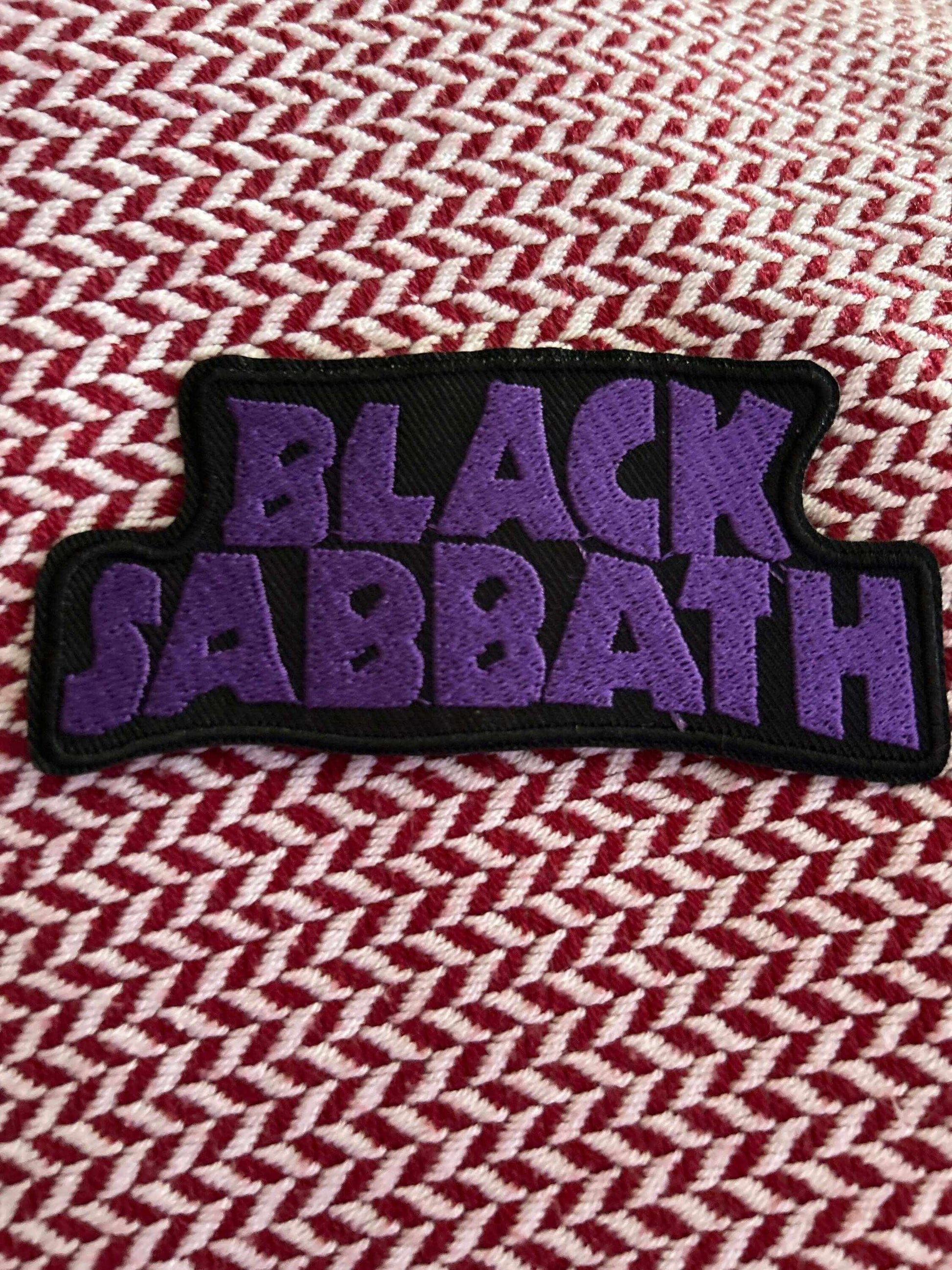 Black Sabbath embroidered Hard Rock Band Patch with purple lettering on black background