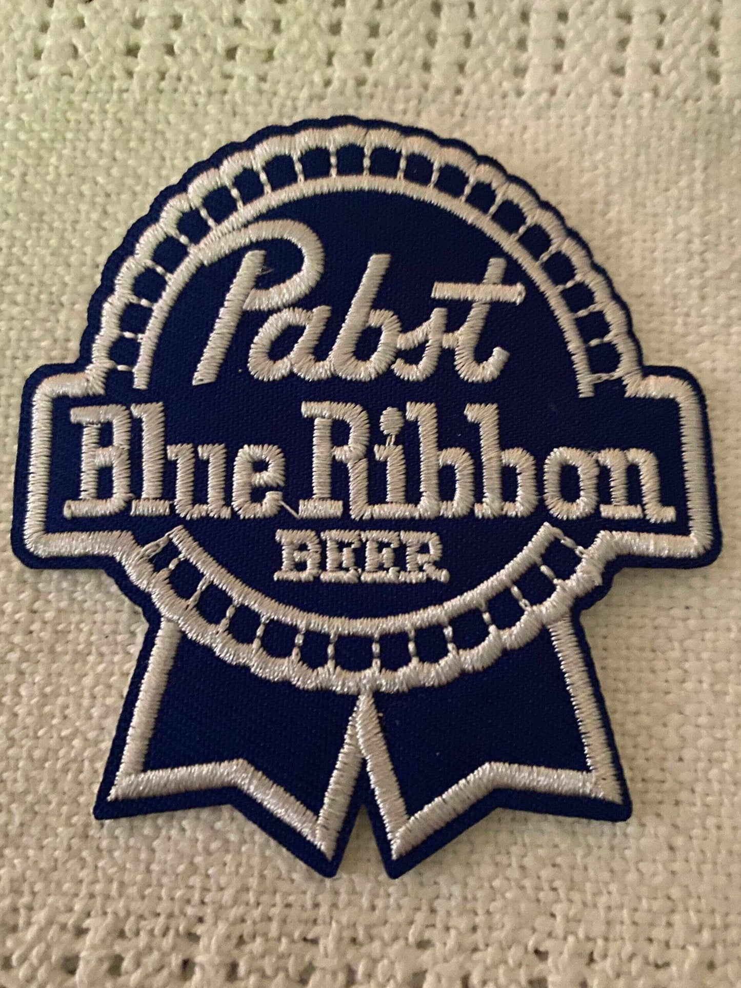 Pabst Blue Ribbon beer logo embroidered patch in blue and white colors