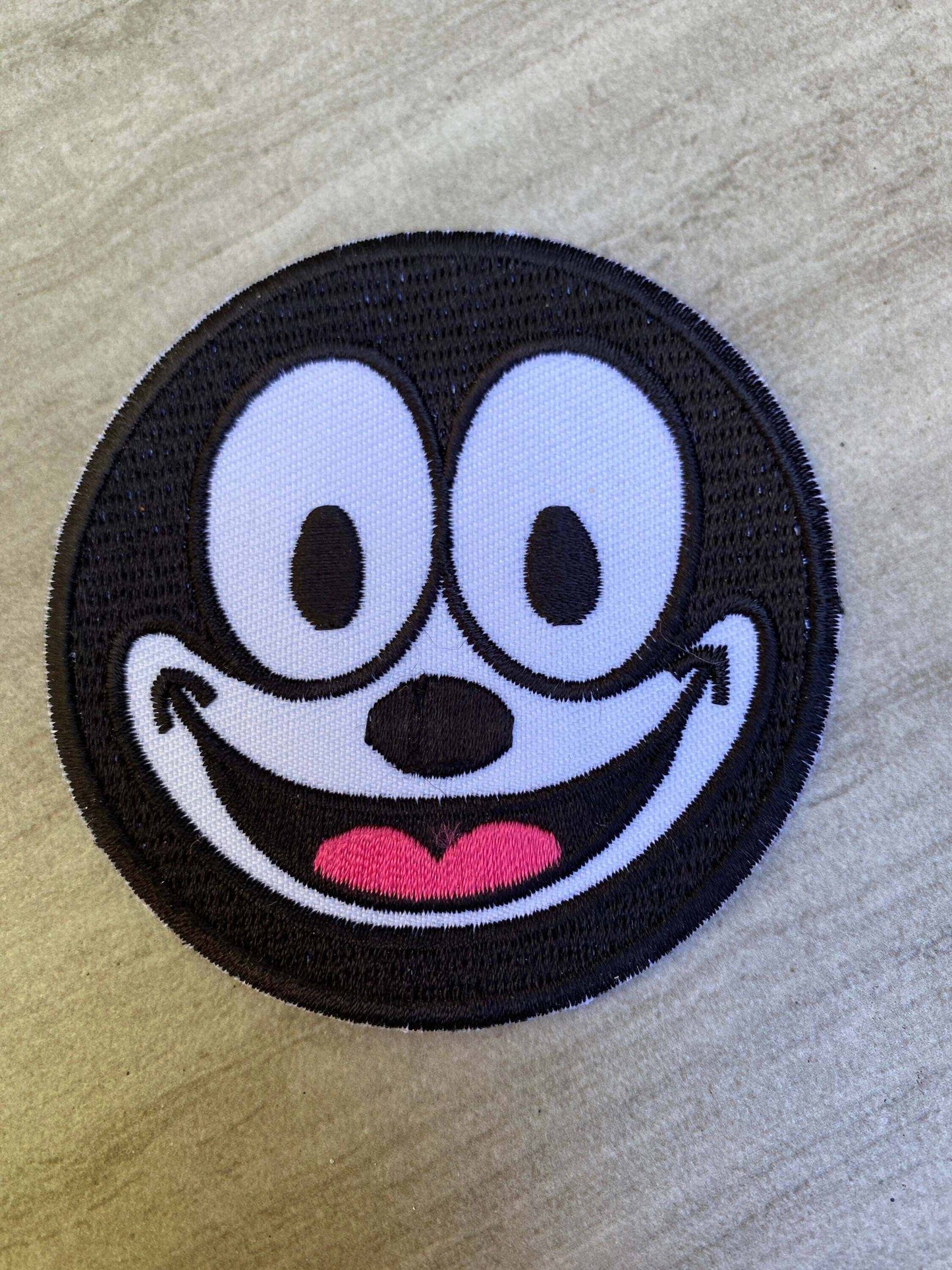 Felix the Cat black and white embroidered patch with signature grin and big eyes