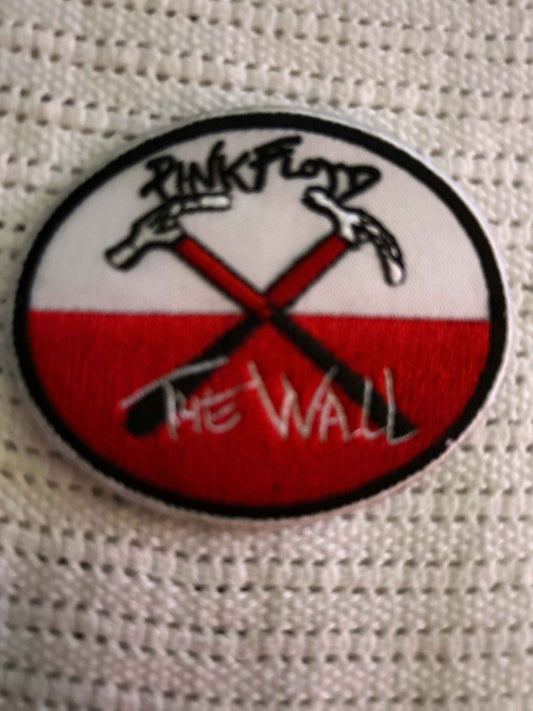 oval wall patch for drywall and plaster repair with crossed hammers design